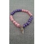 Bracciale handmade perle rosa e viola con ciondolo fatina